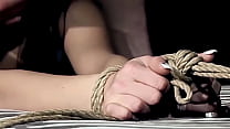 He spanks her ass with flog and hand until red marks on it. The sex slut is begging, but needs to tolerate the painful punishment and learn some manner.